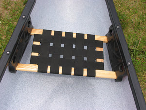 Ash and webbing canoe seat with support brackets.