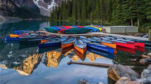 Colourful Paluski canoes at Moraine Lake, Alberta.